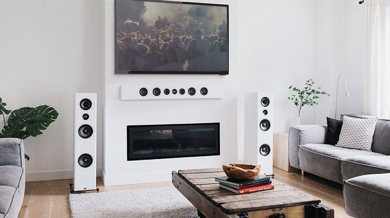 Home theatre with white tower speakers and PWM3 centre channel